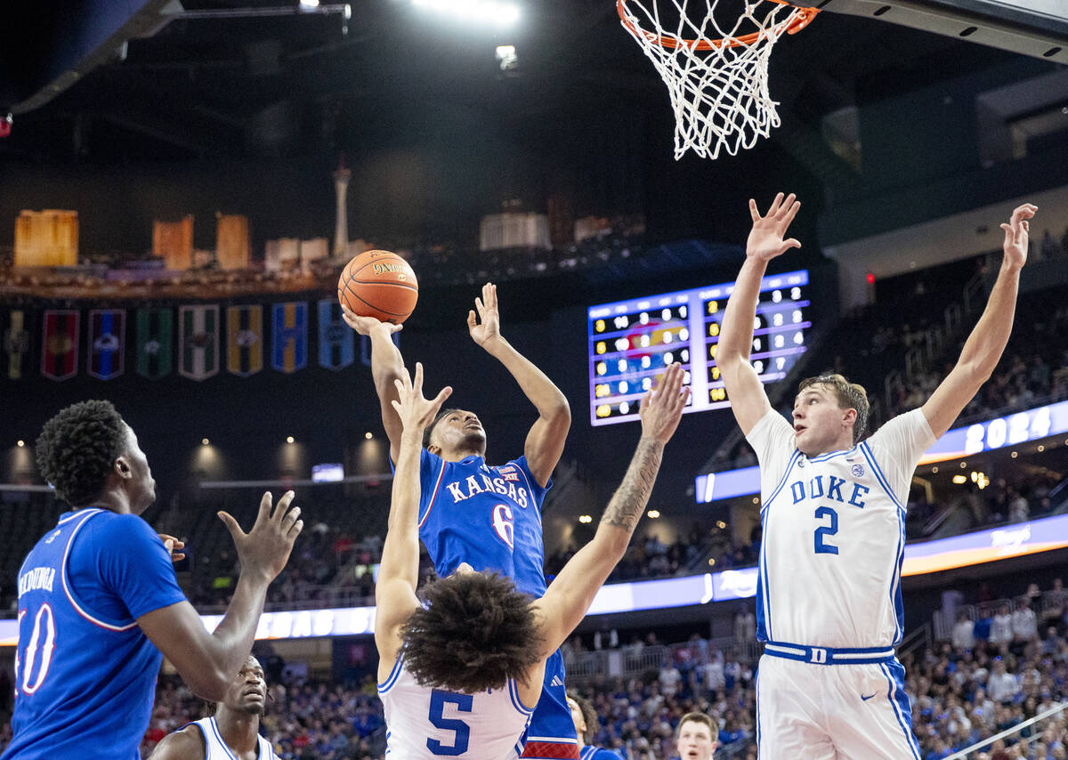 Kansas Jayhawks guard Rylan Griffen (6) attempts a shot during the Vegas Showdown college baske ...