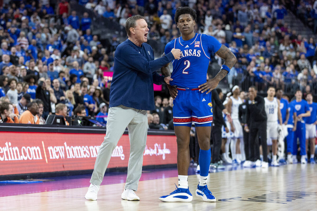 Kansas Jayhawks head coach Bill Self talks to Kansas Jayhawks guard AJ Storr (2) during the Veg ...