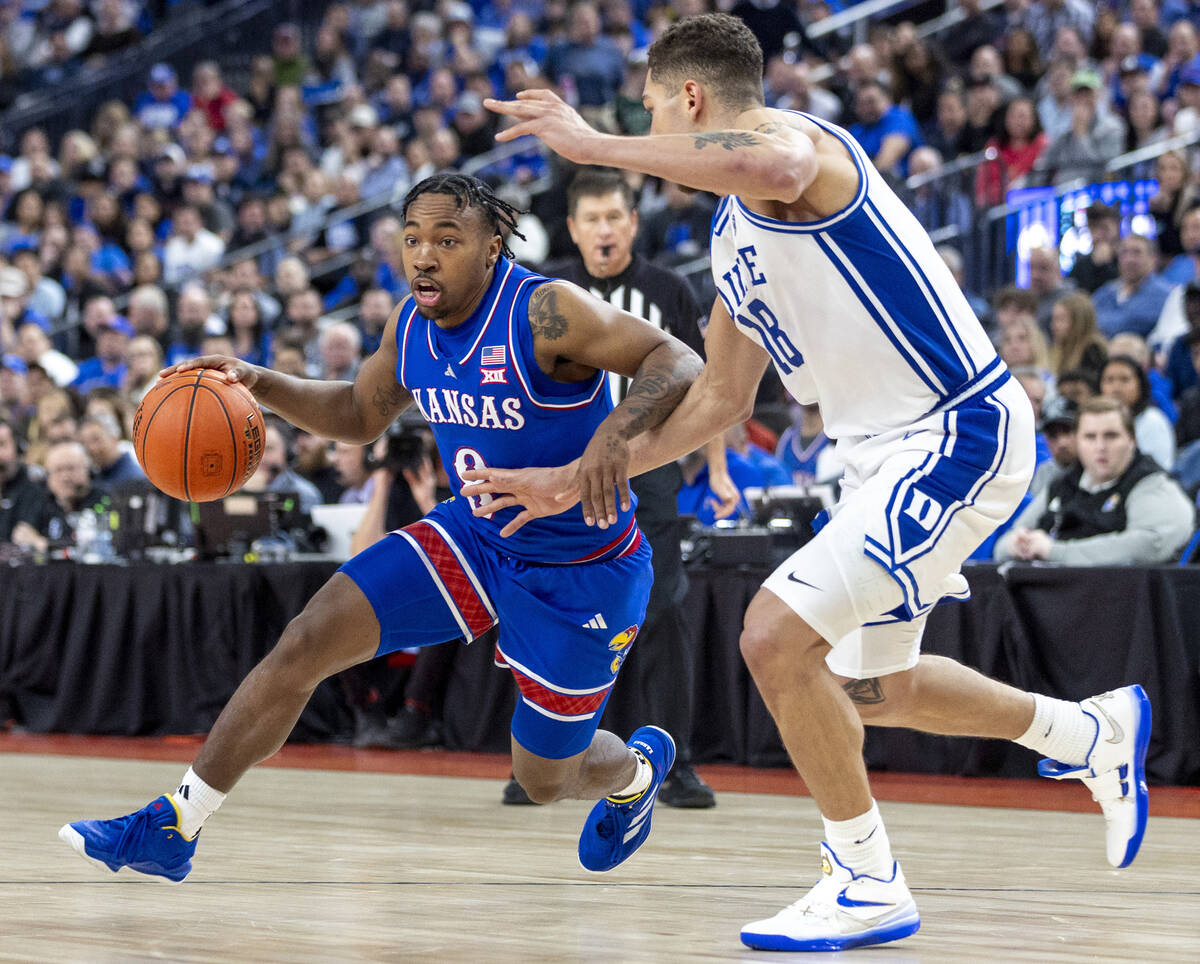 Kansas Jayhawks guard David Coit (8) rushes to the paint during the Vegas Showdown college bask ...