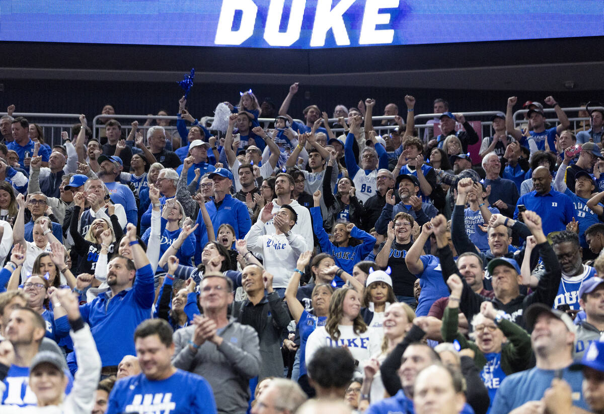 Duke Blue Devil fans cheer after the team begins to rally during the Vegas Showdown college bas ...