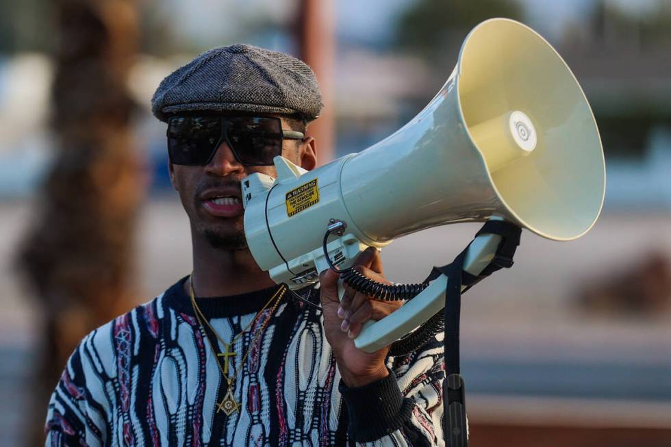 Minister “Stretch” Sanders speaks to a crowd during a vigil for Brandon Durham, w ...