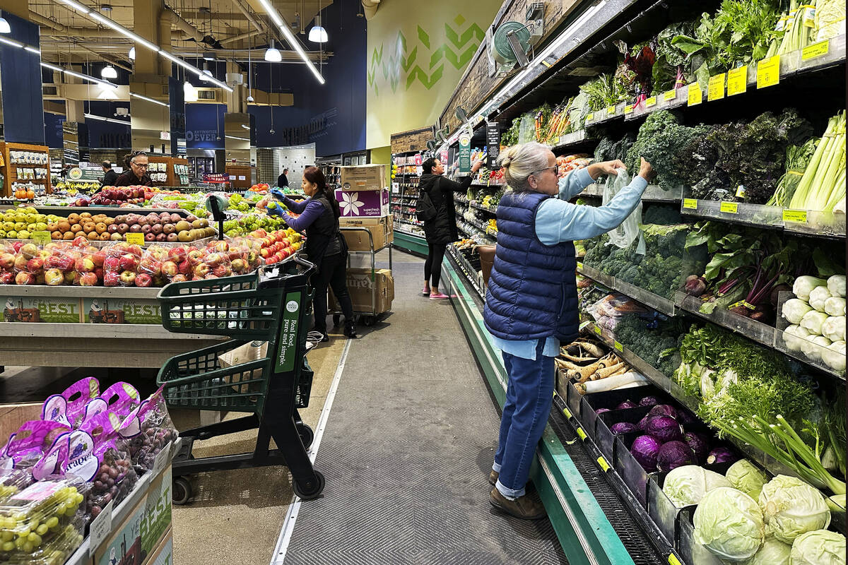 Customers shop at a grocery store in Chicago, Oct. 25, 2024. (AP Photo/Nam Y. Huh, File)