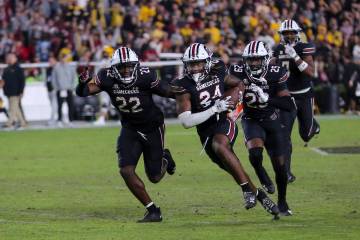 South Carolina celebrates a game clinching interception by defensive back Jalon Kilgore (24) du ...