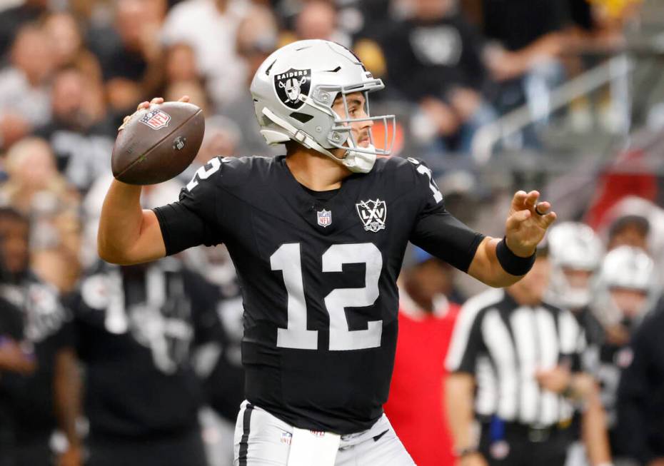 Raiders quarterback Aidan O'Connell (12) throws the ball during the second half of an NFL game ...