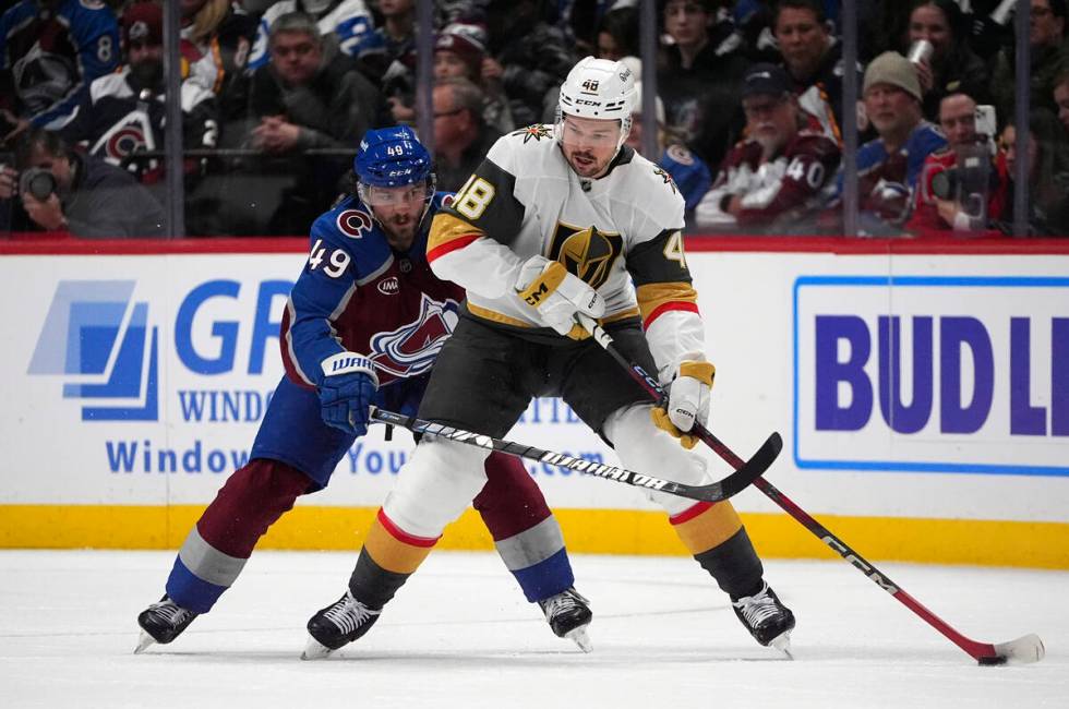 Vegas Golden Knights center Tomas Hertl, front, passes the puck as Colorado Avalanche defensema ...