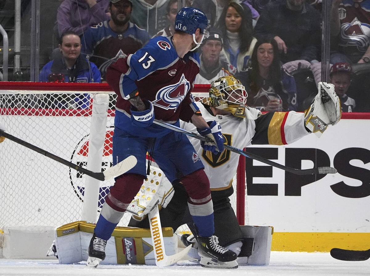 Vegas Golden Knights goaltender Adin Hill, back, makes a glove save of a shot as Colorado Avala ...