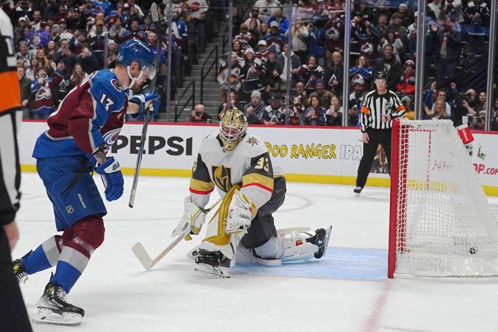 Colorado Avalanche right wing Valeri Nichushkin, left, raises his stick after scoring the winni ...