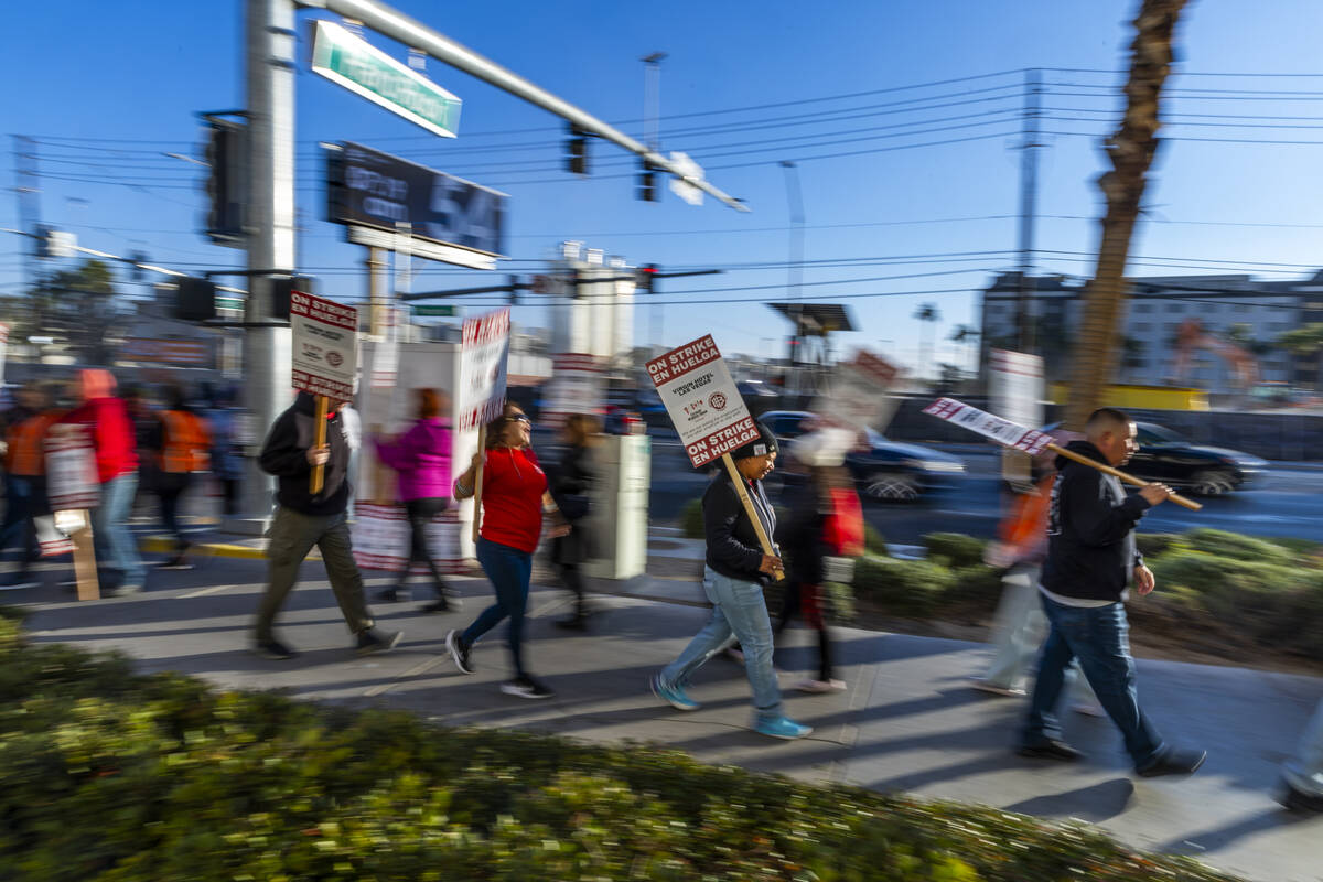 Culinary Local 226 workers strike outside the garage off East Hard Rock Drive at the Virgin Hot ...