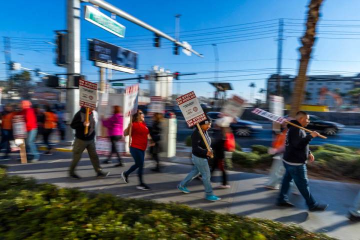 Culinary Local 226 workers strike outside the garage off East Hard Rock Drive at the Virgin Hot ...