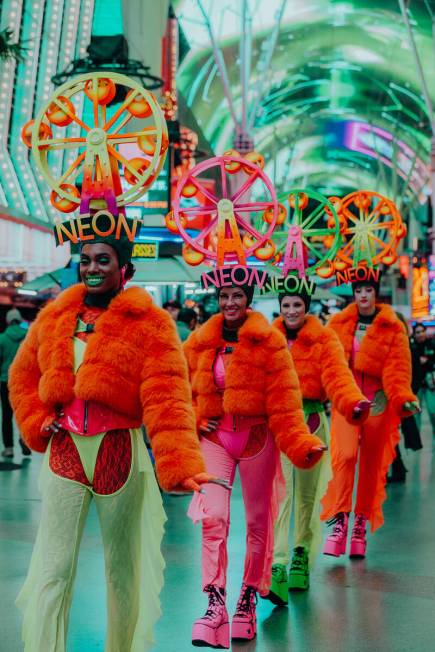 Vegas-fashioned, costumed performers are shown at the Fremont Street Experience during Neon Cit ...