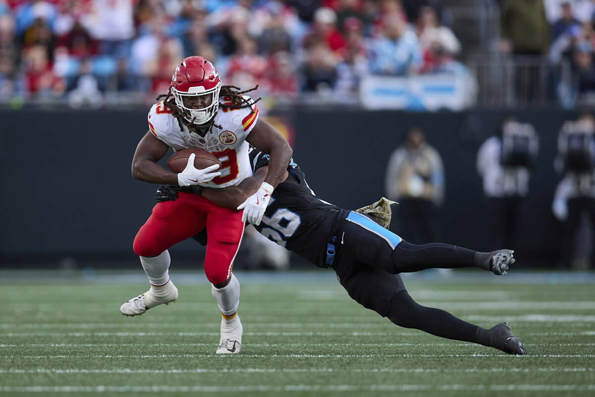 Kansas City Chiefs running back Kareem Hunt (29) is tackled by Carolina Panthers linebacker Tre ...