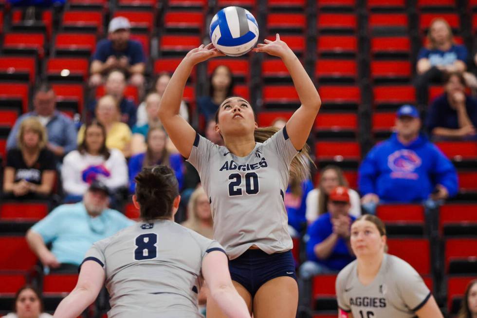 Utah State setter Kaylie Kofe (20) leaps up to bump the ball during a first round game between ...