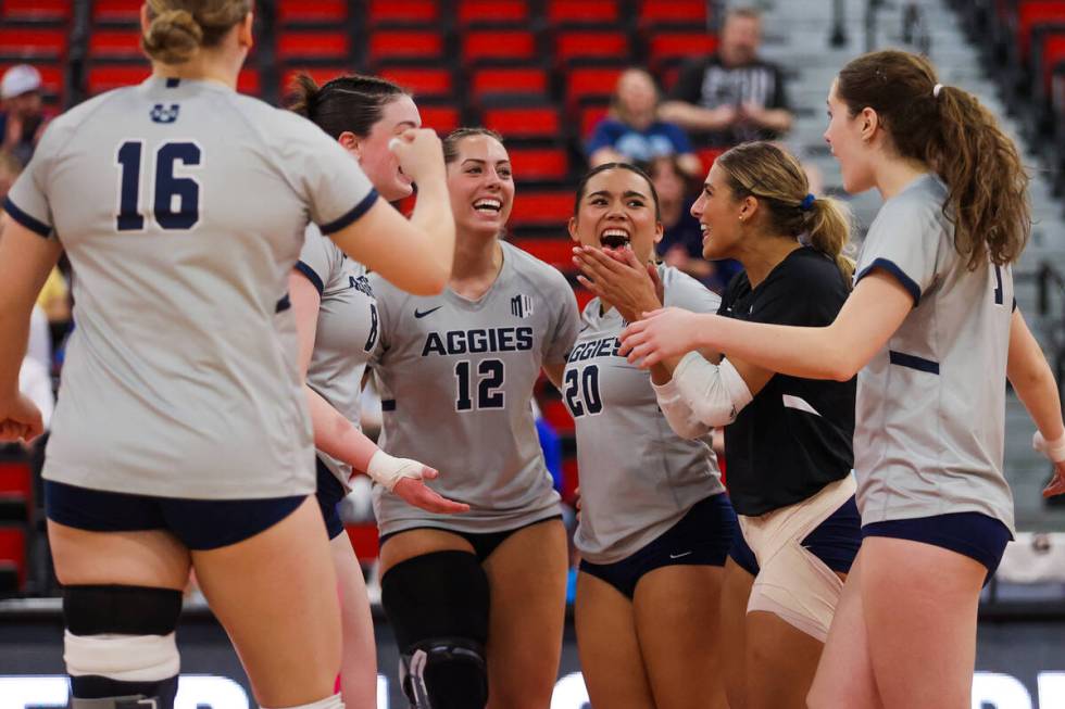 Utah State teammates celebrate a point during a first round game between the Utah State and Boi ...