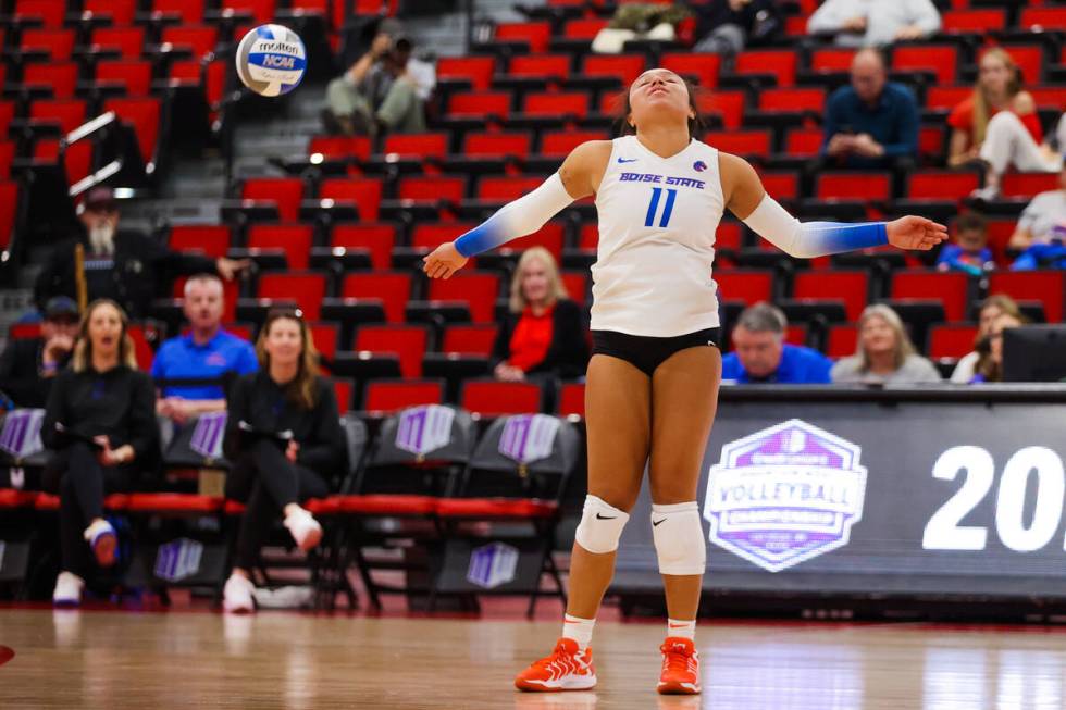 Utah State libero Bre Mitchell reacts after missing the ball during a first round game between ...