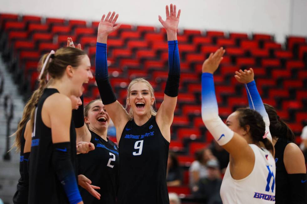 Boise State teammates celebrate a point during a first round game between the Utah State and Bo ...