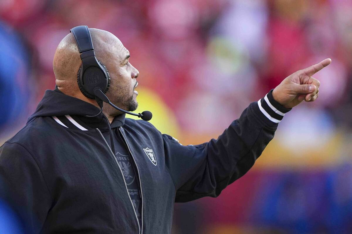 Las Vegas Raiders head coach Antonio Pierce gestures on the sideline during the first half of a ...