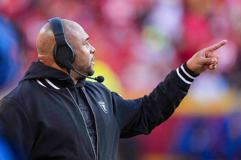 Las Vegas Raiders head coach Antonio Pierce gestures on the sideline during the first half of a ...