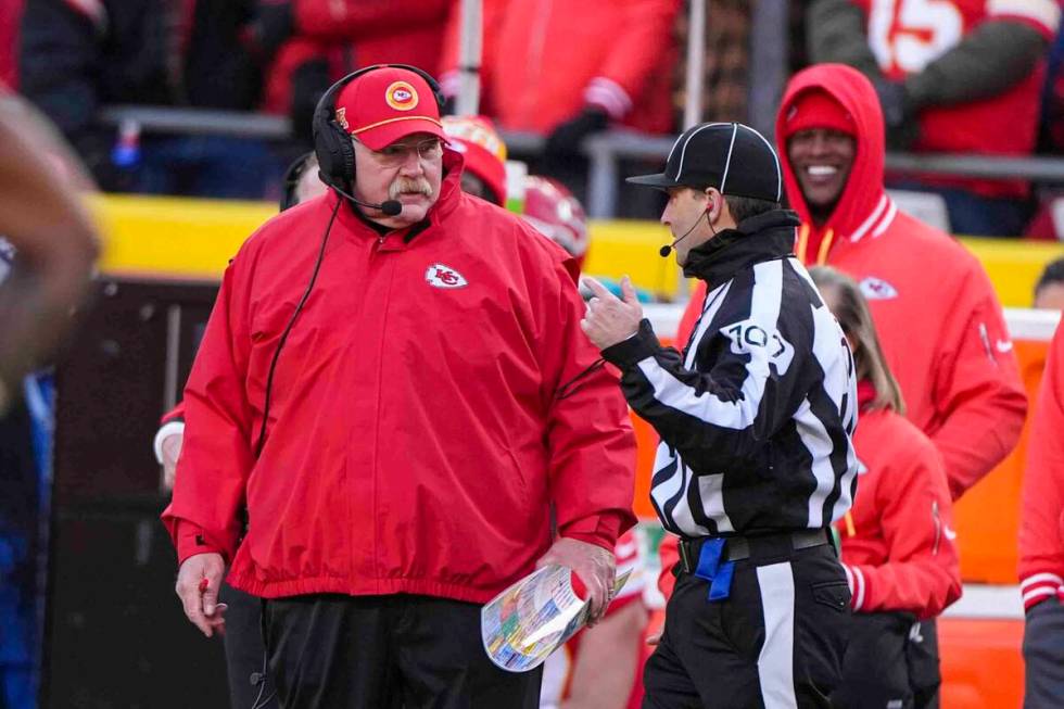 Kansan city Chiefs head coach Andy Reid talks with side judge Dave Hawkshaw (107) during the fi ...