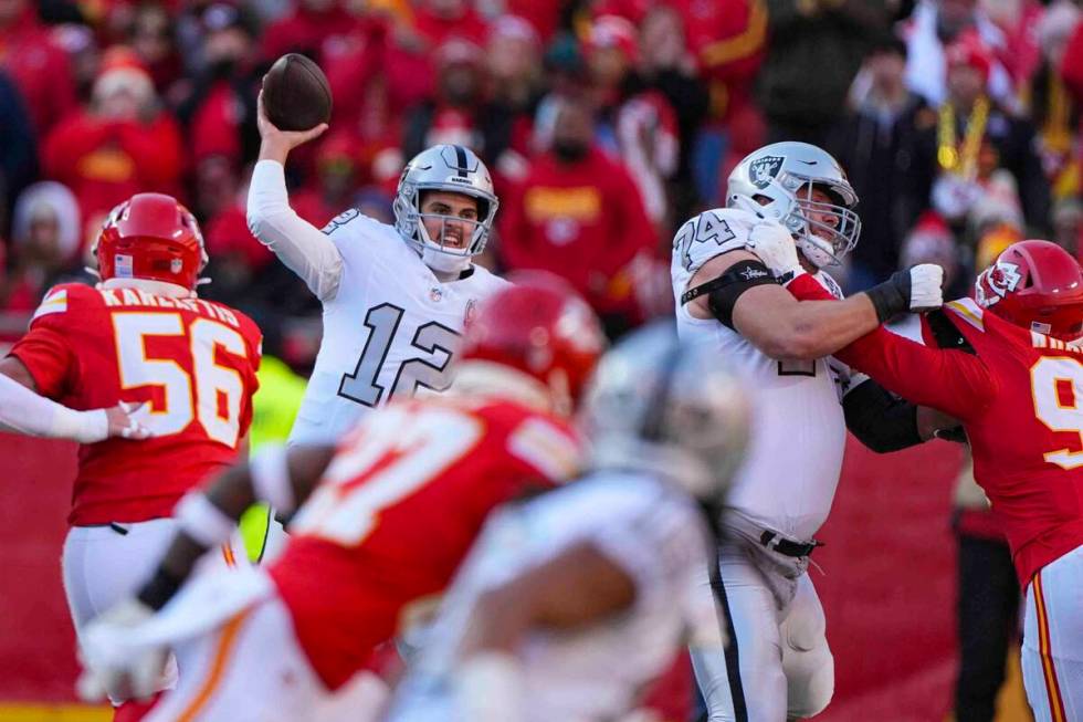 Las Vegas Raiders quarterback Aidan O'Connell (12) throws against the Kansas City Chiefs during ...