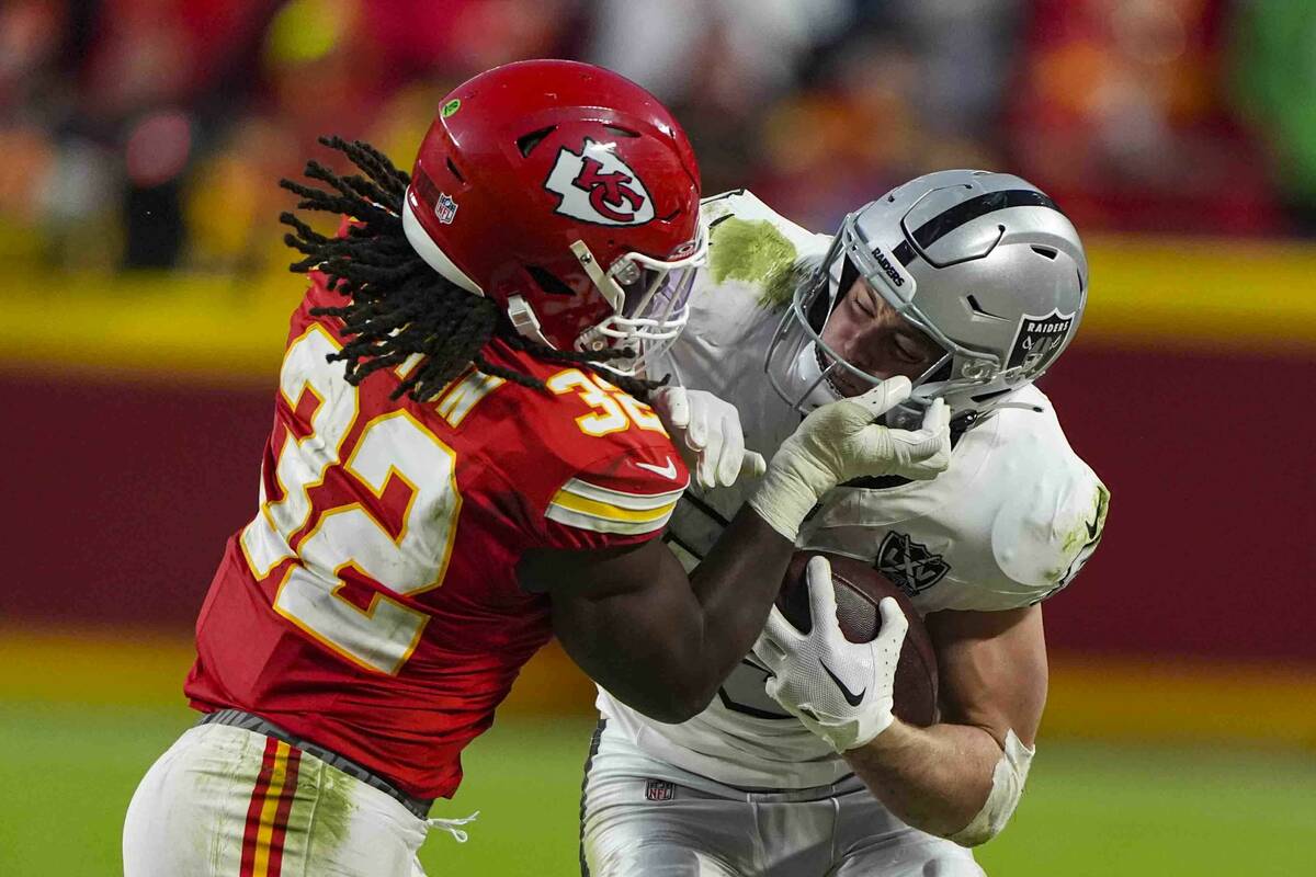 Las Vegas Raiders tight end Brock Bowers (89) is tackled by Kansas City Chiefs linebacker Nick ...