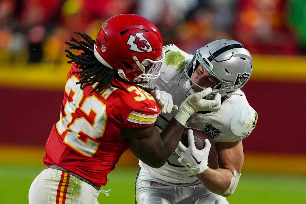 Las Vegas Raiders tight end Brock Bowers (89) is tackled by Kansas City Chiefs linebacker Nick ...