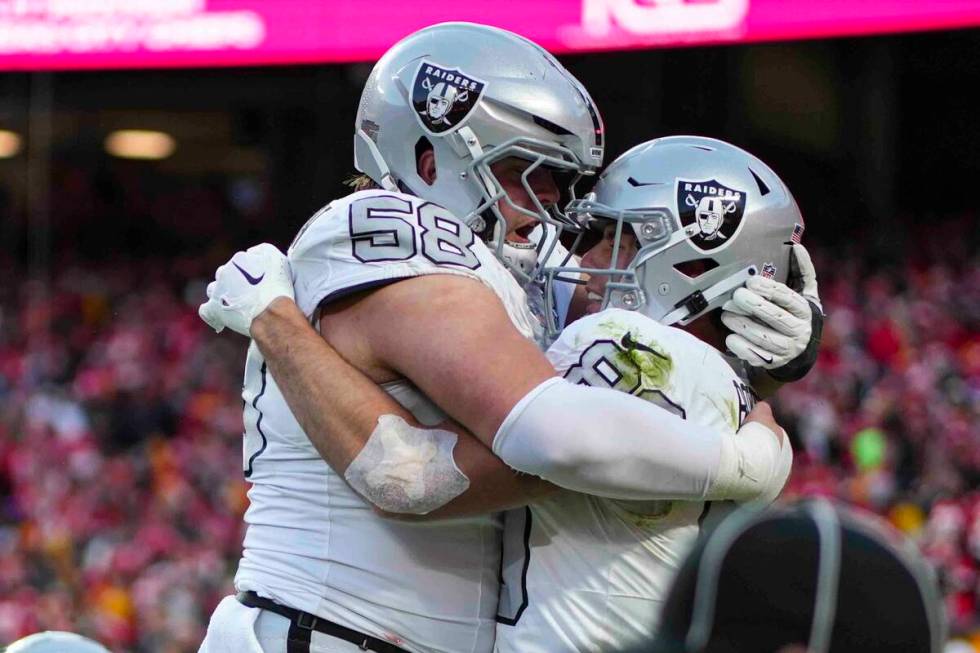 Las Vegas Raiders tight end Brock Bowers, right, celebrates his touchdown with guard Jackson P ...