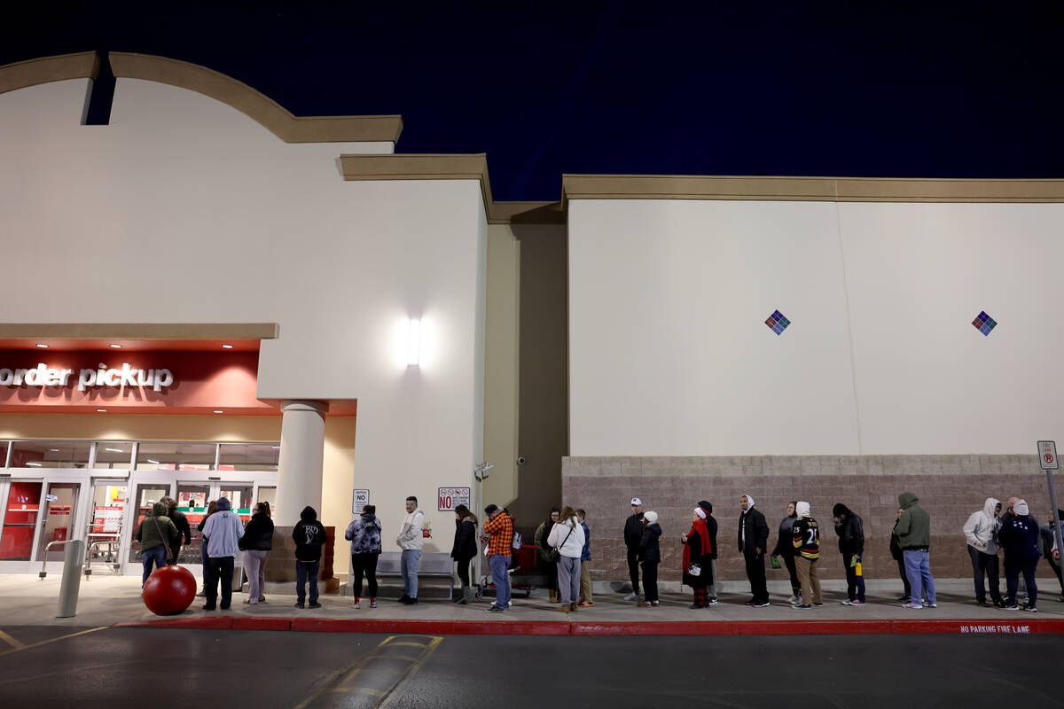 Black Friday shoppers line up for the 6 a.m. opening of the Target store on South Eastern in La ...