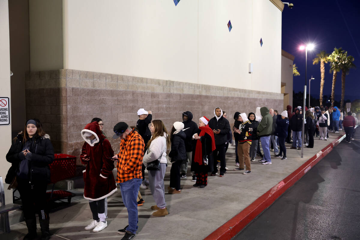 Black Friday shoppers line up for the 6 a.m. opening of the Target store on South Eastern in La ...