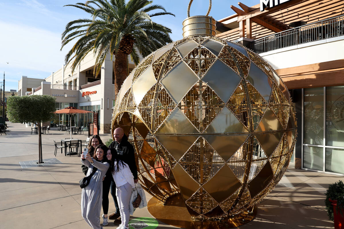 The Ryerson Family, Ken, Kristian, Allie, 25, and Laine, 22, take a selfie in front of a giant ...