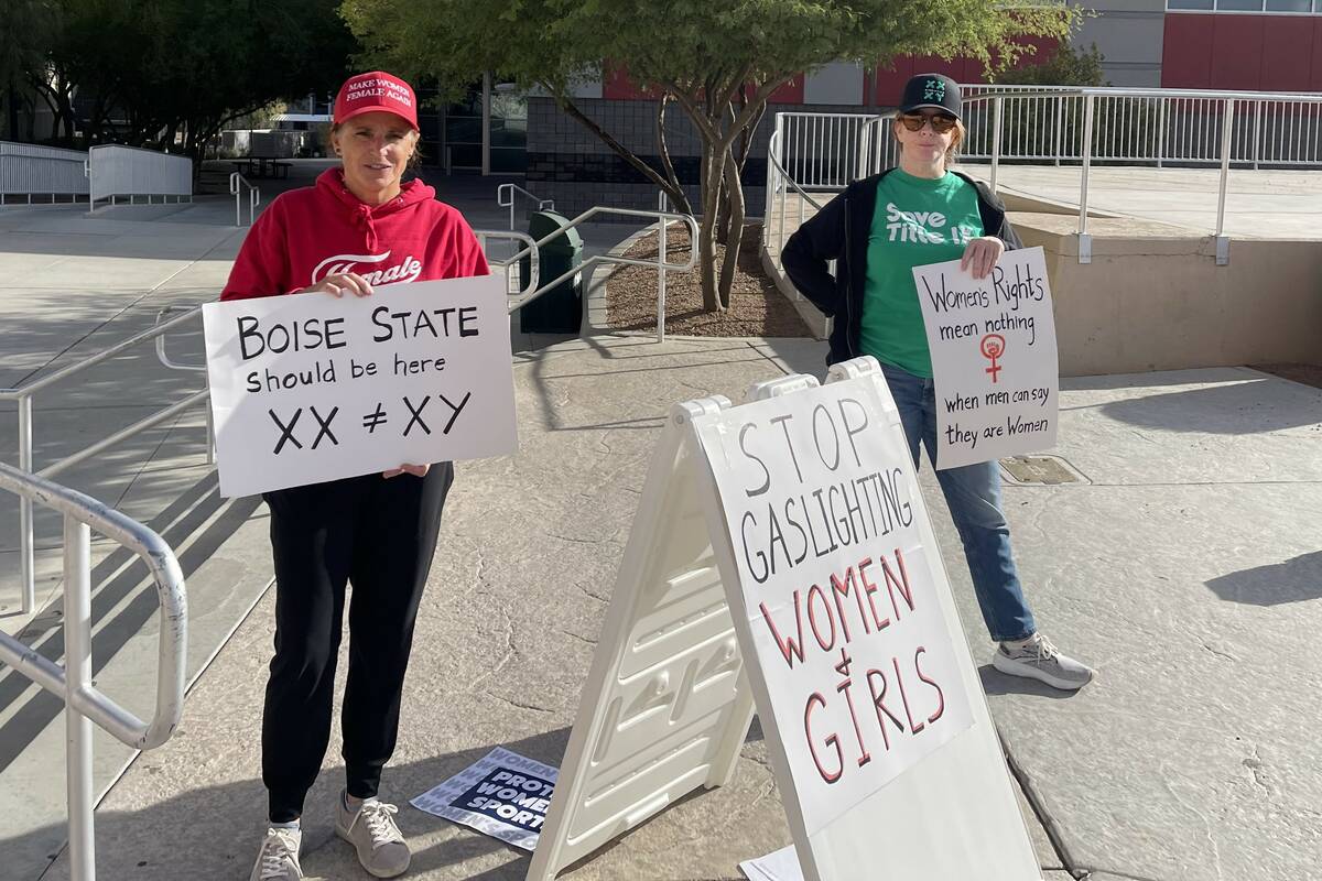 Beth Bourne, left, and another protester who declined to give her name outside Cox Pavilion dur ...