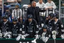 Desert Dogs head coach Shawn Williams talks with players on the bench versus Panther City durin ...