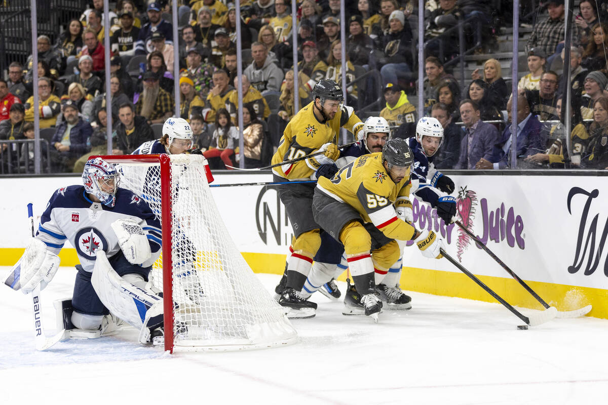 Golden Knights right wing Keegan Kolesar (55) competes for the puck behind the net during the t ...