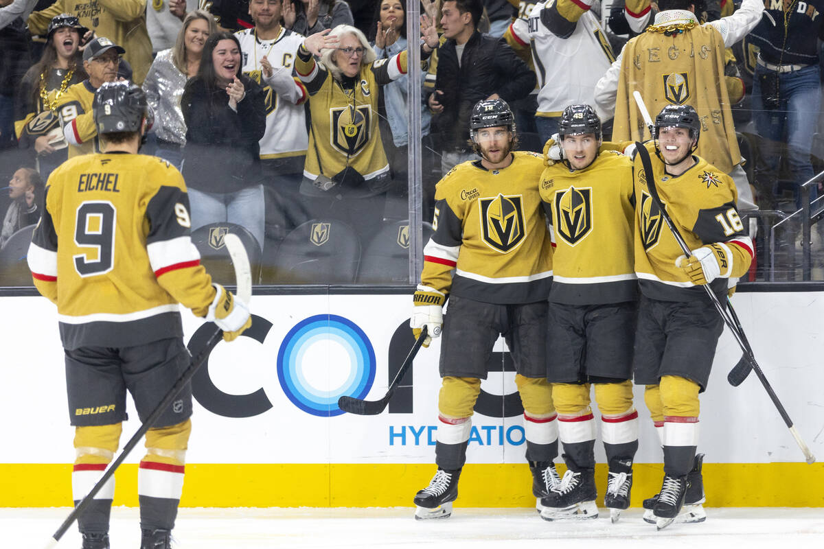 The Golden Knights celebrate a goal during the third period of the NHL hockey game against the ...