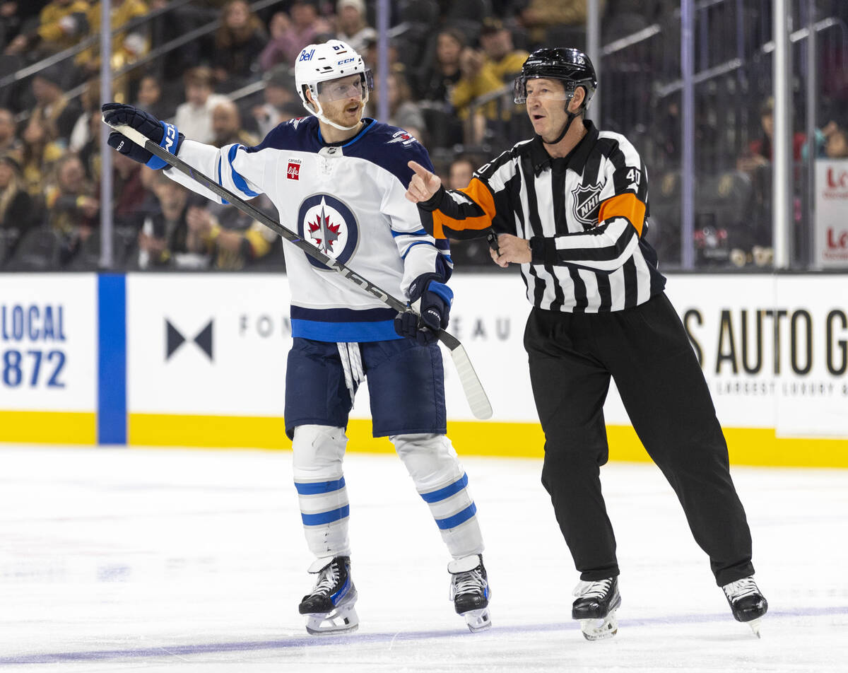 Winnipeg Jets left wing Kyle Connor (81) voices his opinion after being called for a penalty du ...