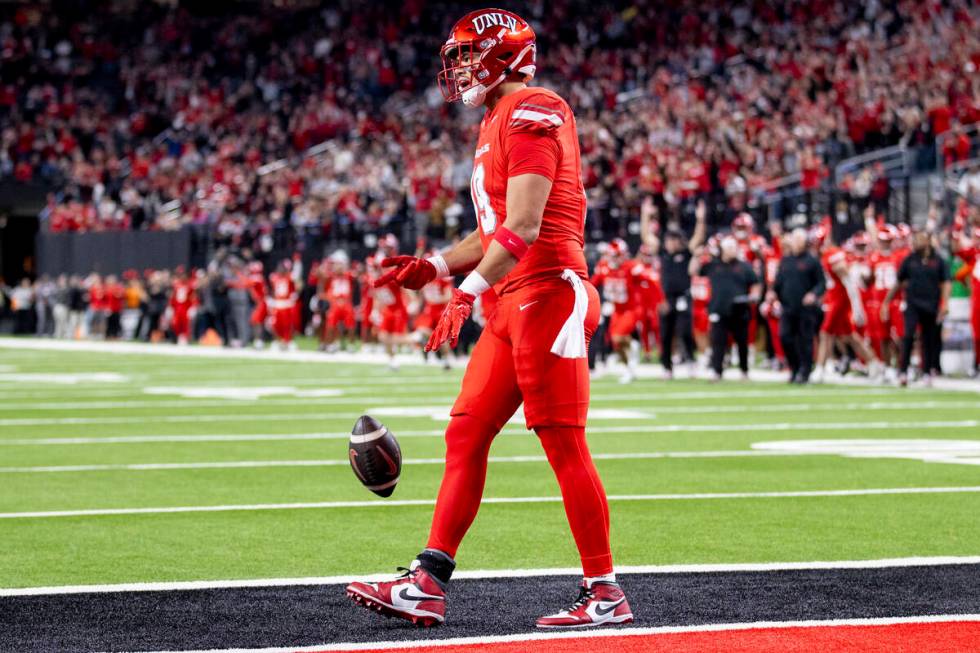 UNLV tight end Kaleo Ballungay (19) celebrates after scoring a touchdown during the NCAA colleg ...