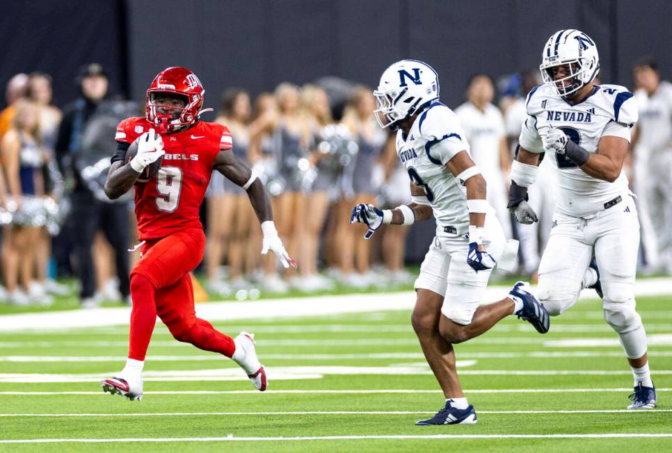 UNLV running back Jai'Den Thomas (9) runs with the ball during the NCAA college football game a ...