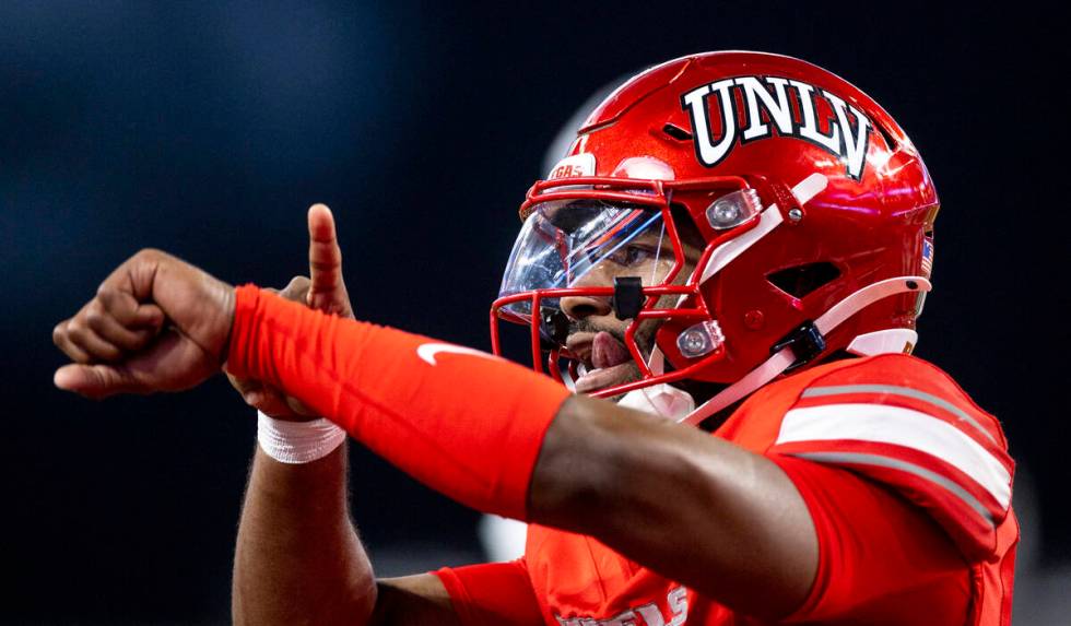 UNLV quarterback Hajj-Malik Williams (6) taps his wrist after scoring a touchdown during the NC ...