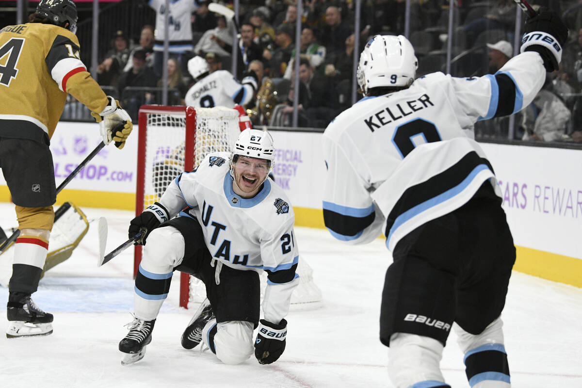 Utah Hockey Club center Barrett Hayton (27) and center Clayton Keller (9) celebrate a goal agai ...