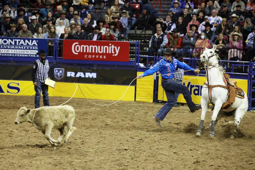 Shad Mayfield of Clovis, New Mexico, competes in the tie-down roping event during the tenth go- ...