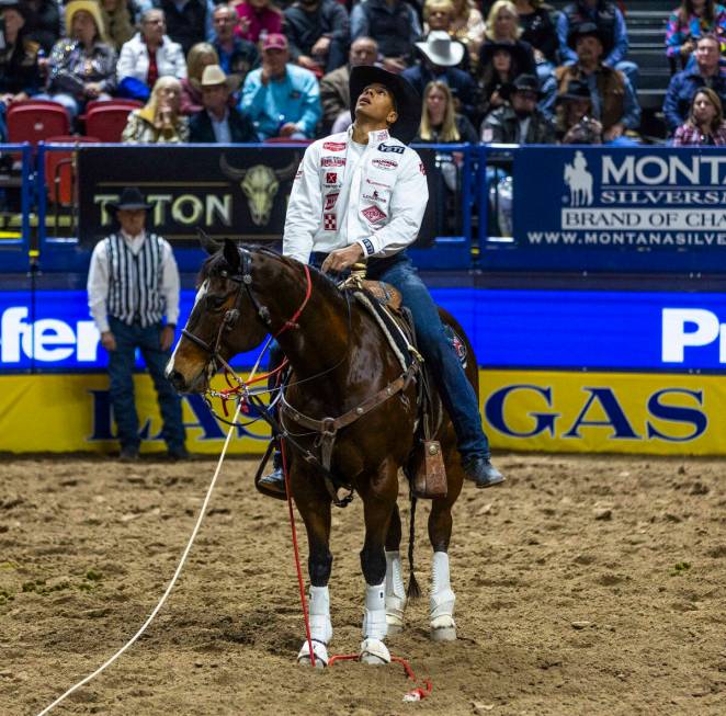 Shad Mayfield looks to then replay in Tie-Down Roping during day 6 action of the NFR at the Tho ...