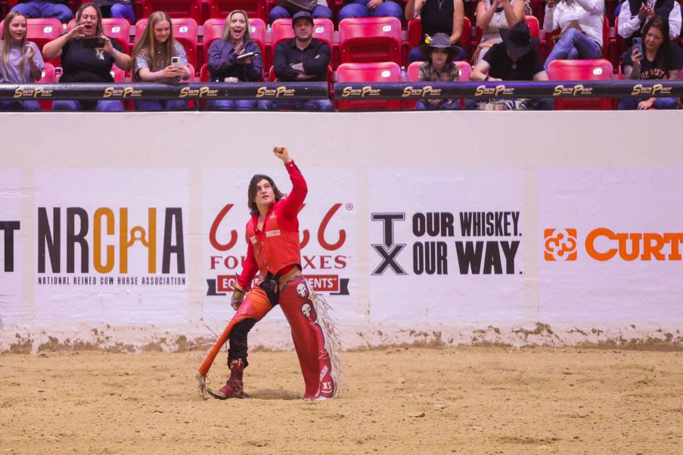 Rocker Steiner pumps his fist into the air after his ride during The Run For A Million bareback ...