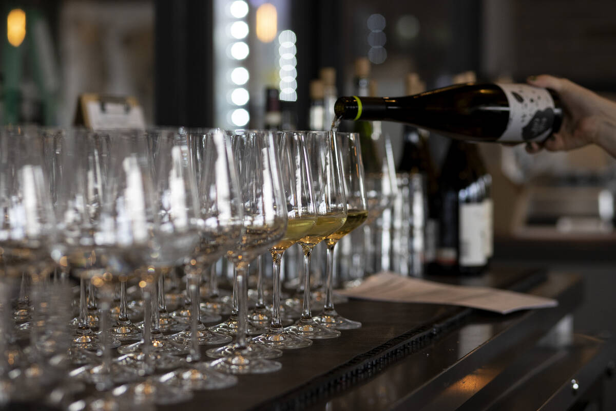 A sommelier pours a flight at Garagiste Wine Room on Wednesday, July 20, 2022, in Las Vegas. (E ...