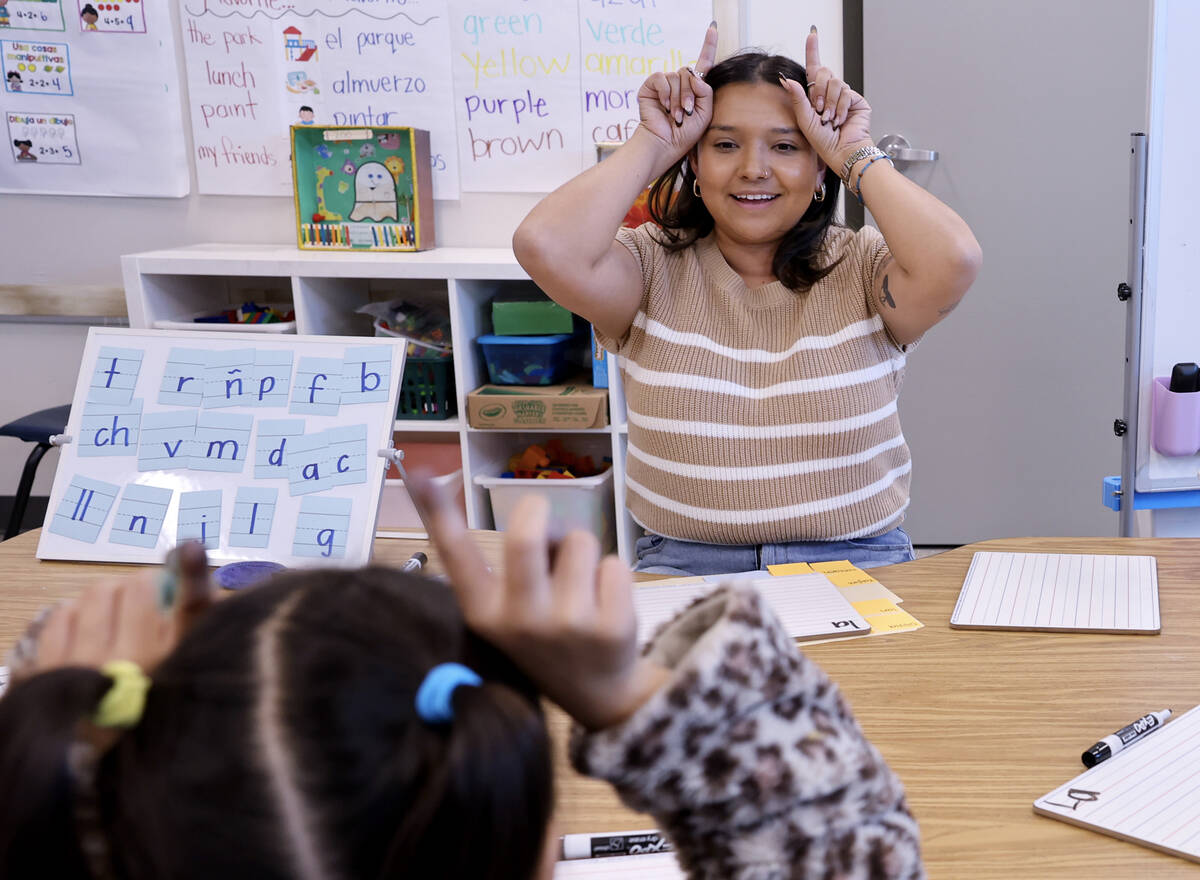 Kinder Dual Language Spanish teacher Liliana Herrejon works with students at Lake Elementary Sc ...