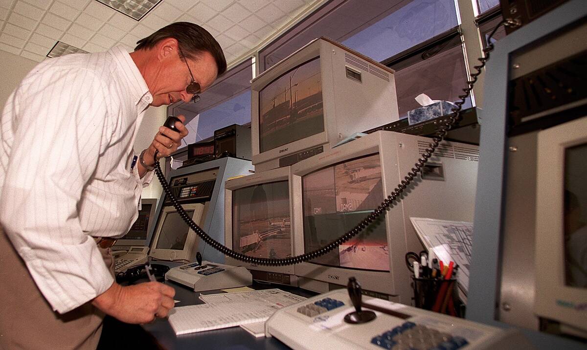 Clark County Dept. of Aviation, Airport Ramp Controller, Harry Petrie communicates with planes ...