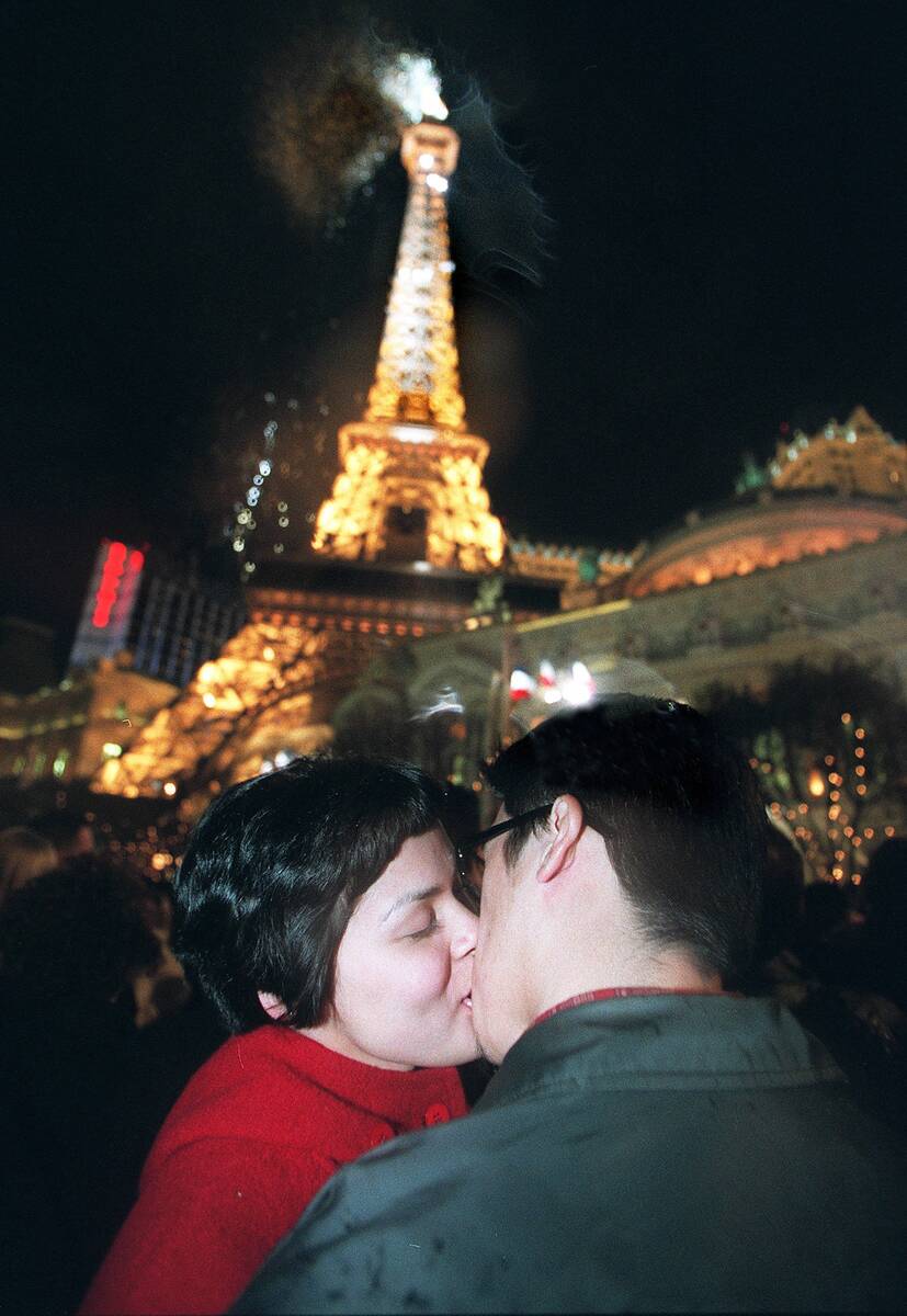 Alex Balagso (left) from San Jose, Calif., kisses her boyfriend Joey Mirandilla as confetti ex ...