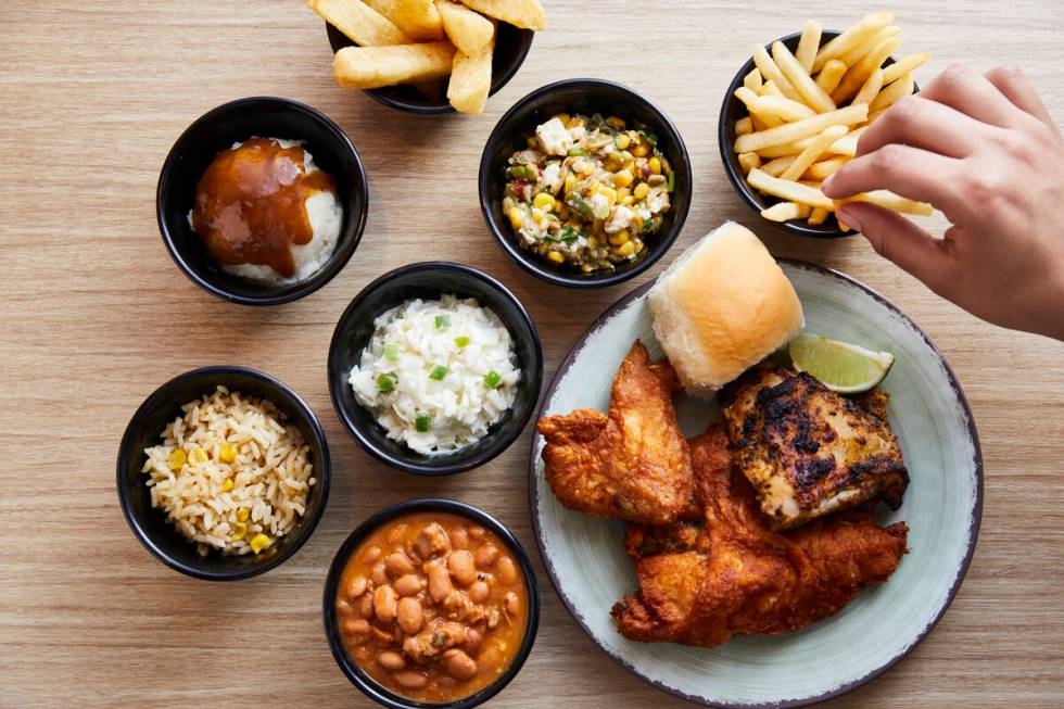 A spread of dishes from Pollo Campero, the Guatemalan chain known for its fried and grilled chi ...