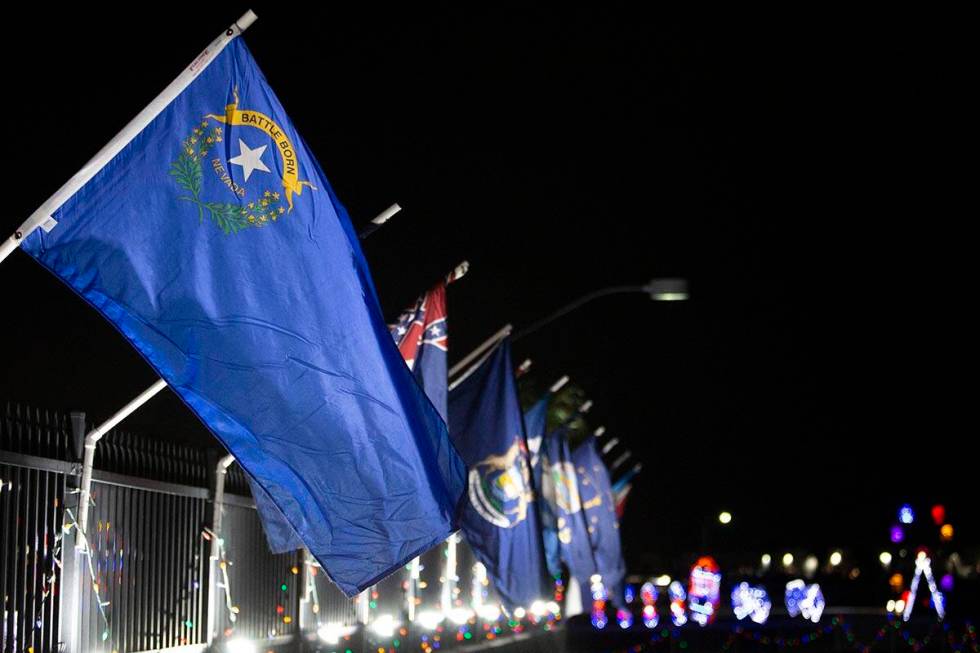 The Nevada state flag sits in a row of all of the flags of the 50 states at Glittering Lights o ...