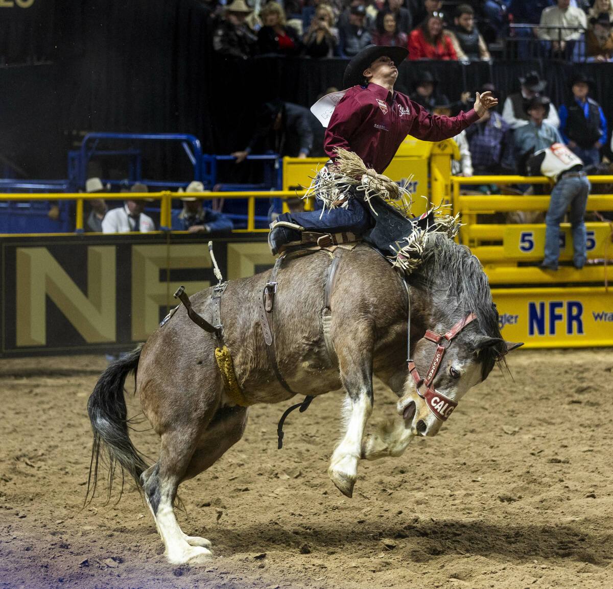 Damian Brennan catches some air in Saddle Bronc Riding during day 6 action of the NFR at the Th ...