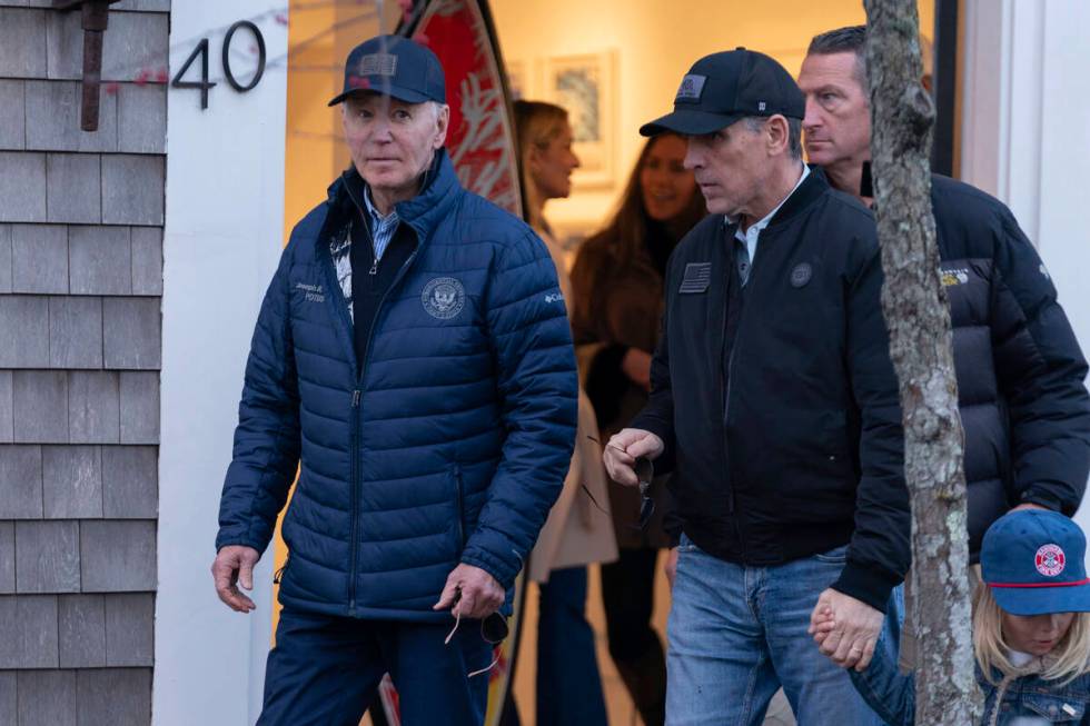 President Joe Biden and son Hunter Biden walk in downtown Nantucket Mass., Friday, Nov. 29, 202 ...