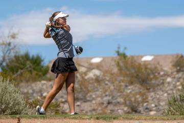 Faith Lutheran’s Maddie Perez watches her ball drive down the fairway during the 5A Dese ...